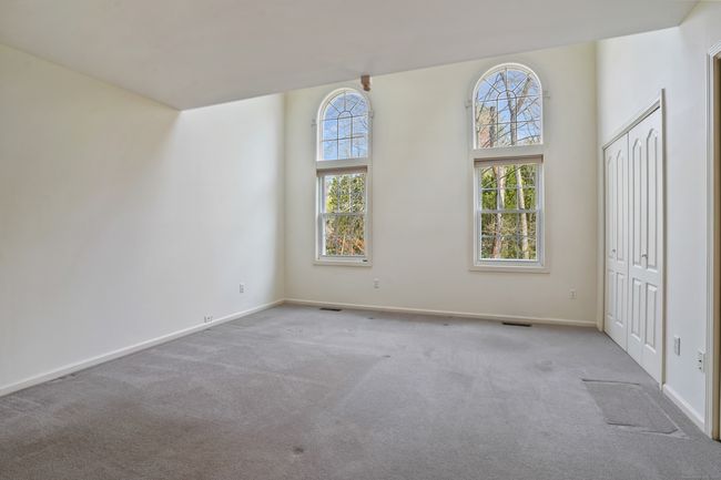 Main floor primary bedroom with double closets | Image 15