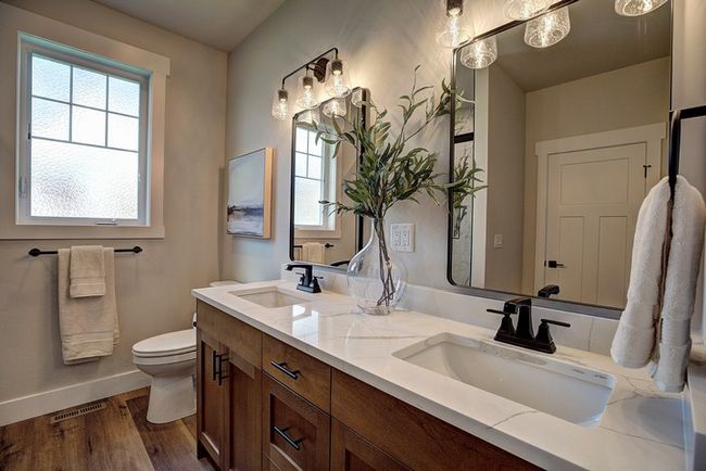 Bathroom with double vanity and dark wood finished floors | Image 25