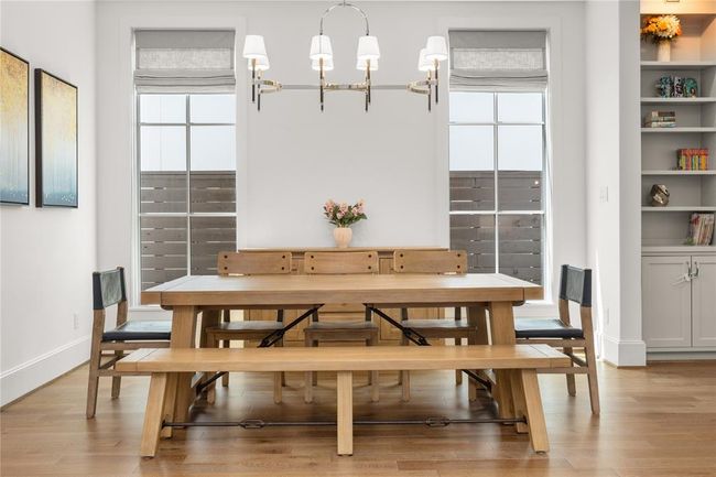 Formal dining w/ natural light and open to the living room & ktichen area | Image 12