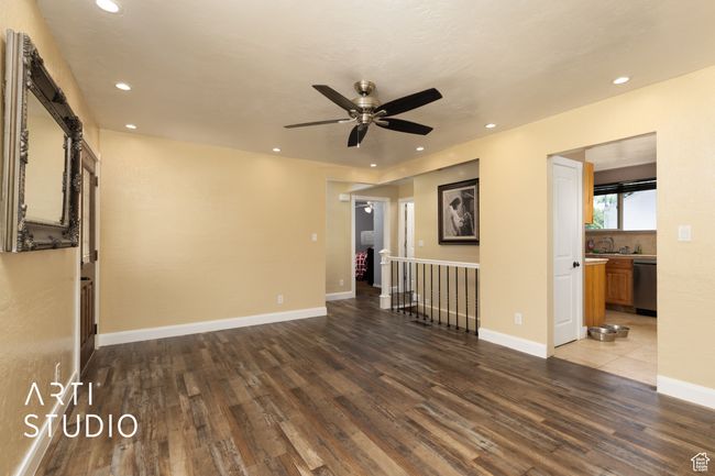 Spare room with a ceiling fan, wood finished floors, recessed lighting, and baseboards | Image 39