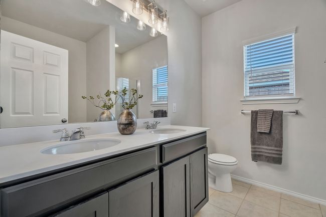 Bathroom featuring double vanity and tile patterned floors | Image 19