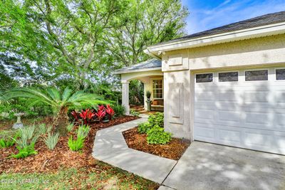 As you walk up to the front porch of this home, you can see the lovely landscaping that the sellers has installed. All irrigation is handled through the HOA. | Image 2