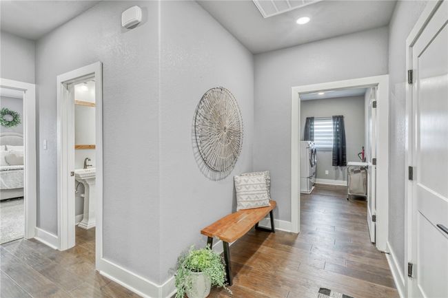 Hall with washer and dryer and dark wood-type flooring | Image 31