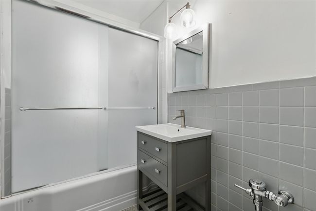 Full bathroom with shower/bath with updated vanity and fixtures. | Image 14
