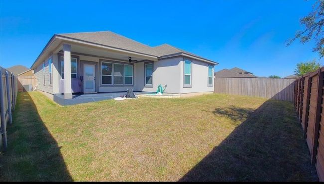 Back of property featuring a fenced backyard, a patio, stucco siding, and ceiling fan | Image 25