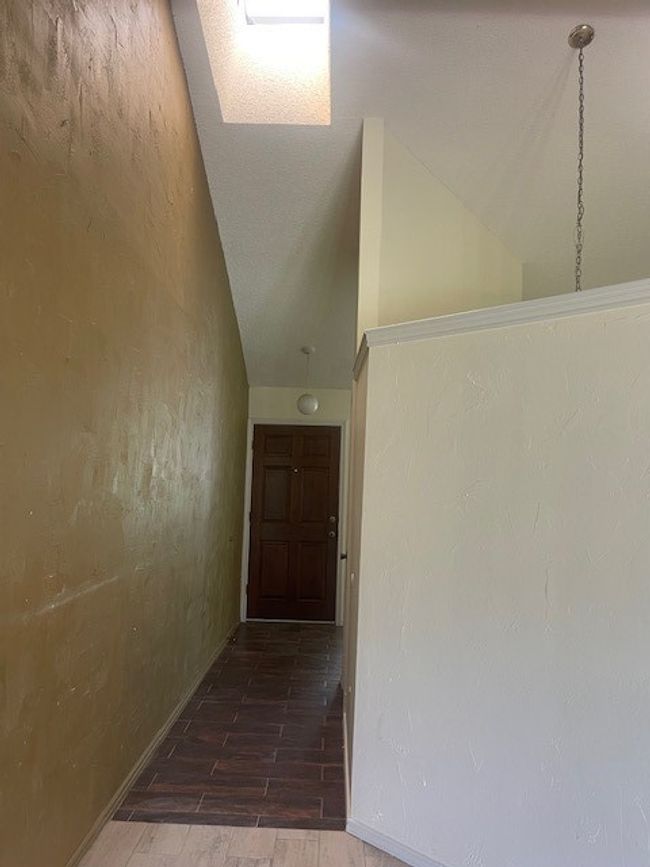 High ceiling and sky light in entry | Image 6