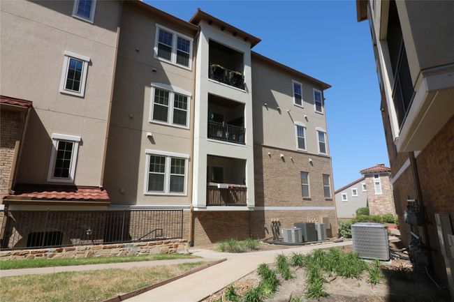 View of building exterior featuring cooling unit | Image 29
