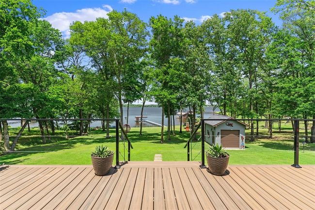 Wooden terrace featuring a yard | Image 24