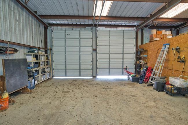 2 10' x 12' tall doors, great for Boats. Enclosed area for the well & yard equipment. Storage space above | Image 36