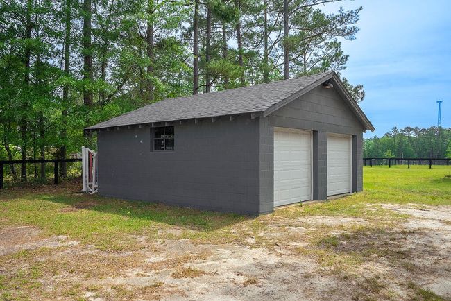 New Mini-Split unit for climate controlled garage/shop space. 220 electric panel, newer garage doors! | Image 4