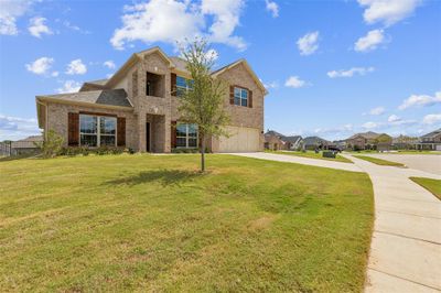 View of front of house with a front yard and a garage | Image 1