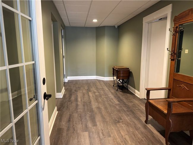 guest room entry to stairs to 3 car garage. | Image 45