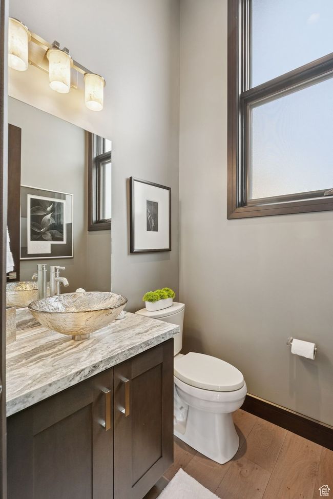 Half bath featuring hardwood / wood-style floors and vanity | Image 41