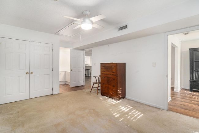 Bedroom featuring attic access, light colored carpet, a closet | Image 4