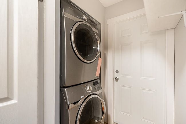 Laundry room with stacked washer / dryer | Image 29