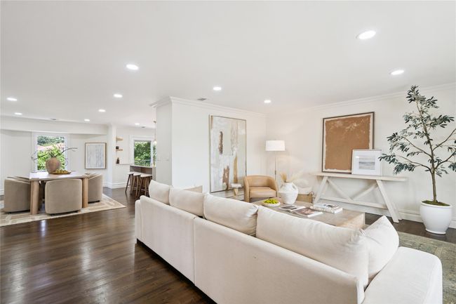 Living area with recessed lighting, dark wood-style flooring, and crown molding | Image 12