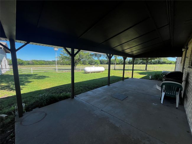 Imagine enjoying a quiet morning or the company of friends on this spacious patio as you overlook lush pastures and feel the refreshing breeze blowing through. | Image 5