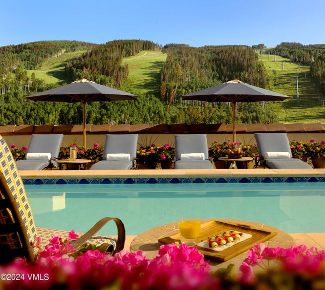 This is your rooftop retreat—unwind poolside with panoramic views of Vail Mountain rising before you. Exclusive to Arrabelle residents and guests, the heated pool, hot tubs, and plush loungers turn every season into spa season. | Image 20