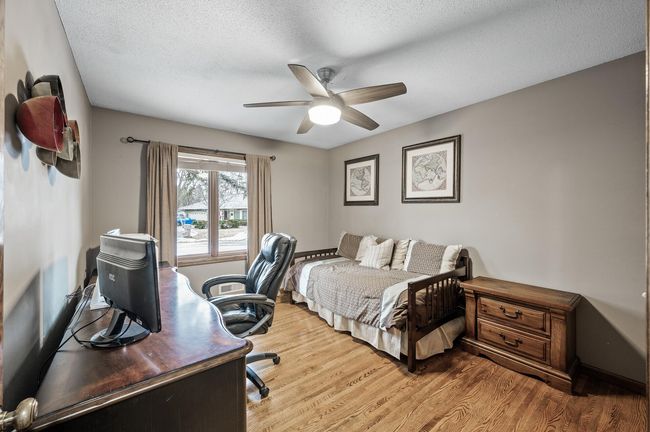 Main floor bedroom three - Currently used as a office - Gorgeous hardwood floors and a nice view of the front yard | Image 32