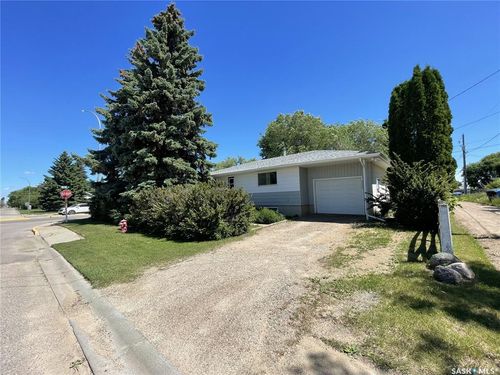 West side of house with Single attached heated garage | Card Image