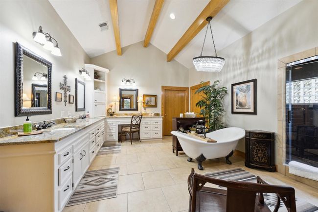 Primary bath with soaking tub, shower and two oversized walk in closets. | Image 25