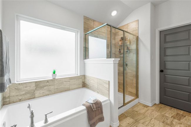 Full bathroom with a bath, a shower stall, lofted ceiling, and recessed lighting | Image 21