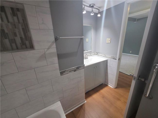 Bathroom featuring wood finished floors and vanity | Image 18