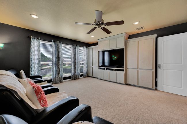 Living area with light carpet, ceiling fan, and recessed lighting | Image 24