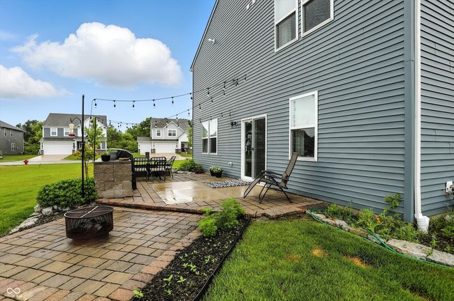 view of patio featuring a fire pit | Image 36