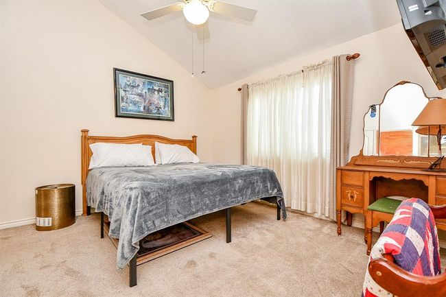Here's a roomy carpeted secondary bedroom, with great natural light. | Image 33