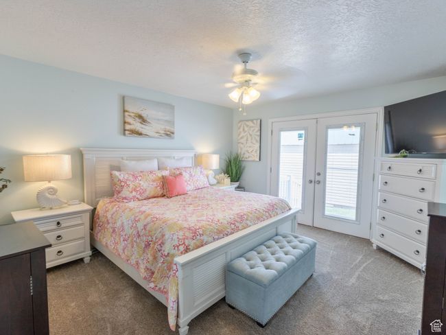 Carpeted bedroom with access to exterior, a textured ceiling, and ceiling fan | Image 15