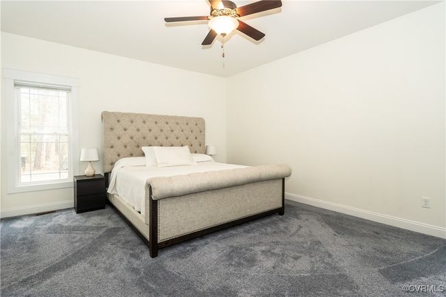 Carpeted bedroom featuring baseboards and ceiling fan | Image 17