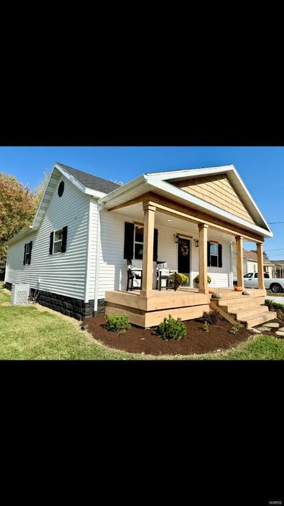 View of front of property featuring covered porch and a front lawn | Image 2