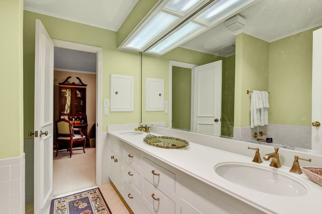 Full bath with double vanity and tile patterned flooring | Image 28