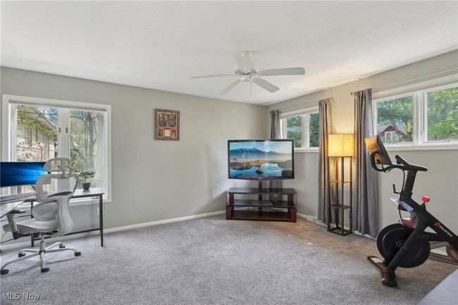 Carpeted home office with ceiling fan and baseboards | Image 22