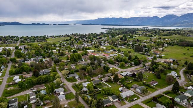 Drone / aerial view featuring a water and mountain view | Image 7