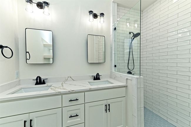 Master Bathroom featuring double vanity and walk in shower | Image 26