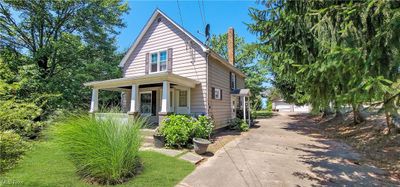 View of front of house with a porch and a garage | Image 2