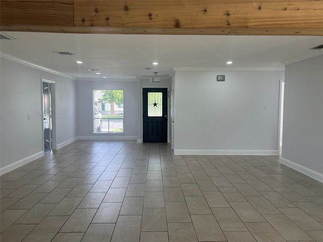 Unfurnished room featuring recessed lighting, ornamental molding, and light tile patterned flooring | Image 4