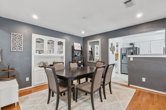 Formal dining room has built-in cabinets for storing dishes, or serving drinks! | Image 8