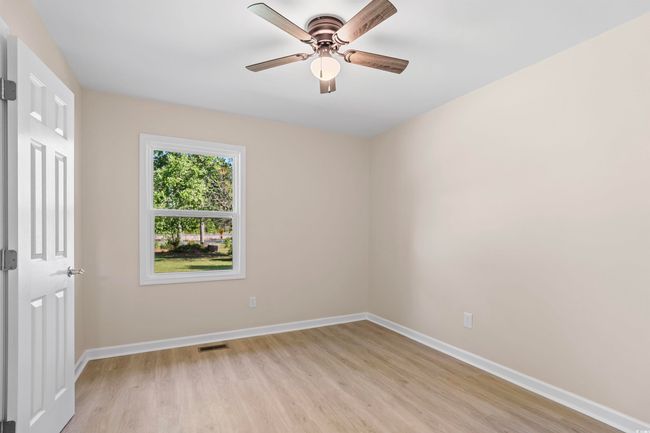 Empty room featuring light wood finished floors and a ceiling​​‌​​​​‌​​‌‌​‌‌​​​‌‌​​‌‌​‌​​​​​‌ fan | Image 23