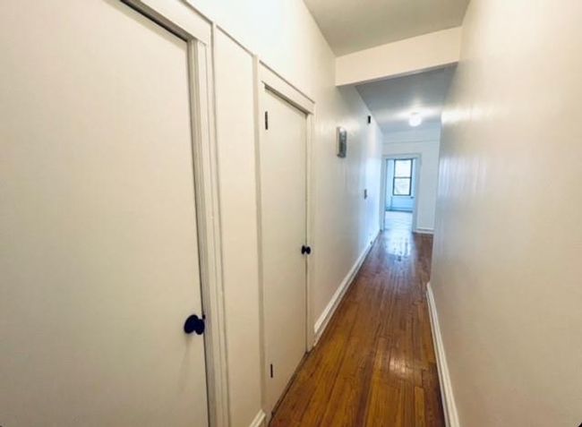 Entrance Hallway featuring hardwood / wood-style floors and two closets | Image 9