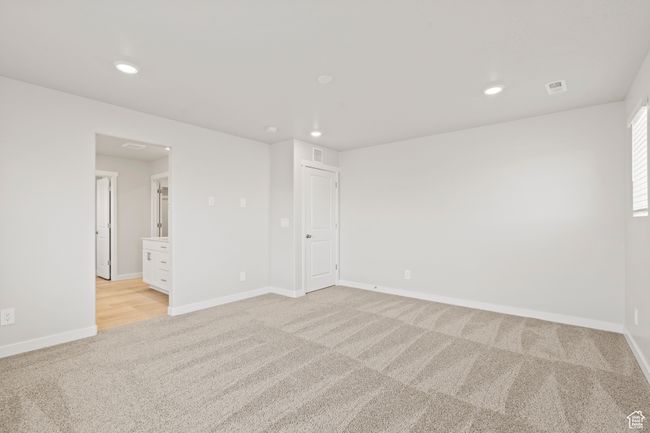 Empty room featuring light colored carpet, recessed lighting, and baseboards | Image 31