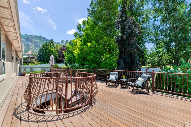 Deck with outdoor dining space and a mountain view | Image 50