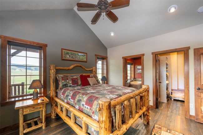 Bedroom featuring high vaulted ceiling, multiple windows, wood finished floors, recessed lighting, and baseboards | Image 20