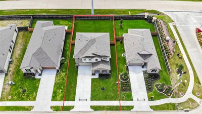 This home sits on a large lot with ample yard space in front and the back, lush landscaping and a well-maintained yard. | Image 2