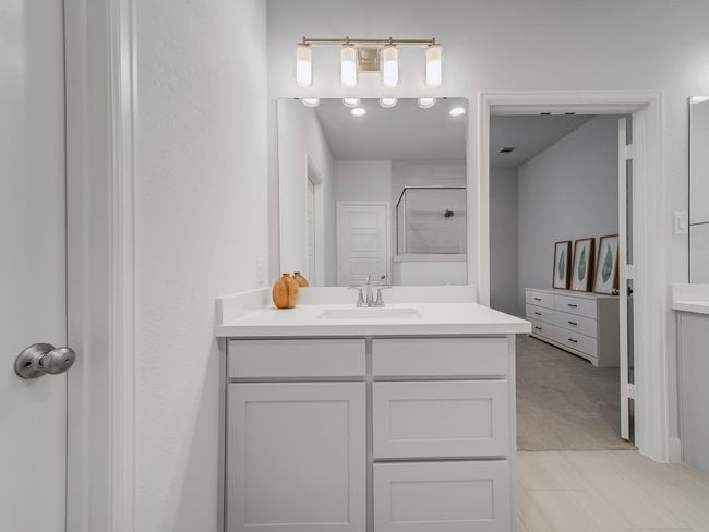 Bathroom featuring vanity and a shower | Image 21