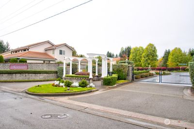 Gated entrance to this all ages town-home style condominium | Image 2