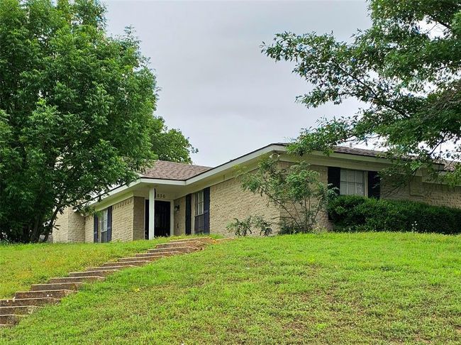 8836 View of front of home featuring a front lawn | Image 10