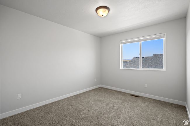 Spare room with carpet and baseboards | Image 31